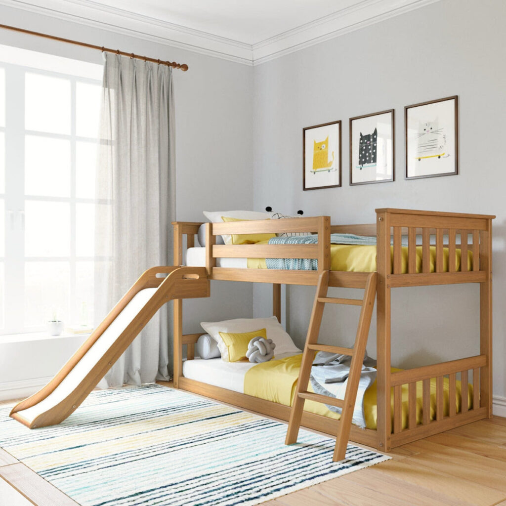 wooden bunk bed with ladder and slide in a bedroom. 